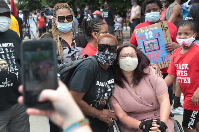  Senator Tammy Duckworth (D-IL) greets people before the start of a Juneteenth march organized by faith leaders on June 19, 2020 in Chicago, Illinois.