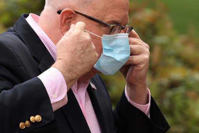 Maryland Gov. Larry Hogan replaces his surgical mask after talking to reporters during a news briefing in front of the Maryland State House April 17, 2020 in Annapolis, Maryland.