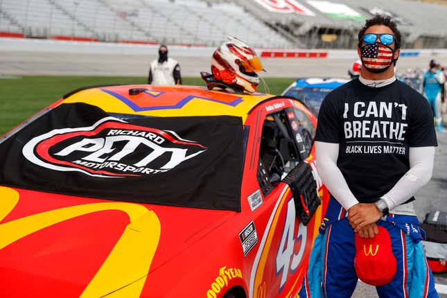 Bubba Wallace, driver of the #43 McDonald’s Chevrolet, stands during the national anthem prior to the NASCAR Cup Series Folds of Honor QuikTrip 500 at Atlanta Motor Speedway on June 07, 2020 in Hampton, Georgia.