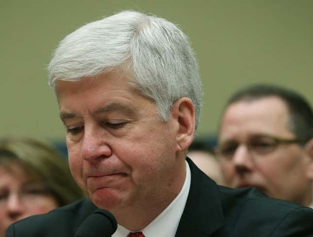 Gov. Rick Snyder, (R-MI), listens to members comments during a House Oversight and Government Reform Committee hearing, about the Flint, Michigan water crisis, on Capitol Hill