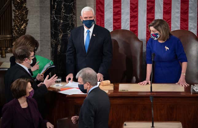 Vice President Mike Pence presides over a joint session of Congress with Speaker of the House Nancy Pelosi (D-Calif.) on January 6, 2021, in Washington, D.C. Congress held a joint session today to ratify President-elect Joe Biden’s 306-232 Electoral College win over President Donald Trump.