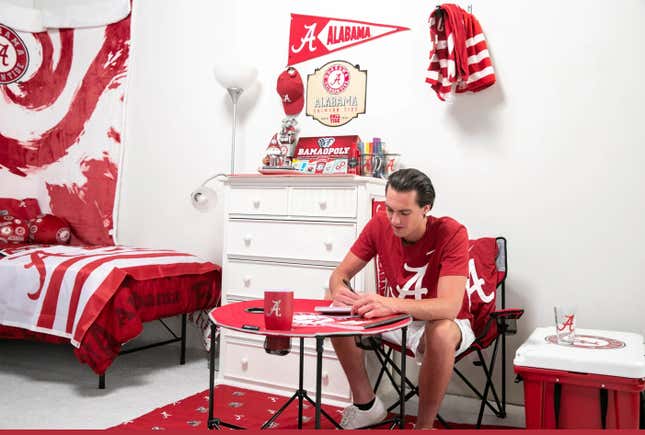 Image for article titled We Challenged Two Guys To Decorate A Dorm Room Using Only Fan Merch
