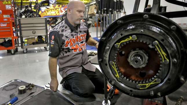 John Sweeney works on the axle of a monster truck Nov. 25, 2014, at Feld Entertainment in Ellenton, Fla.
