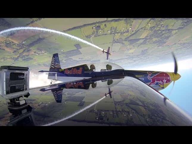 Watch A Stunt Plane Do A Roll Around Another Plane