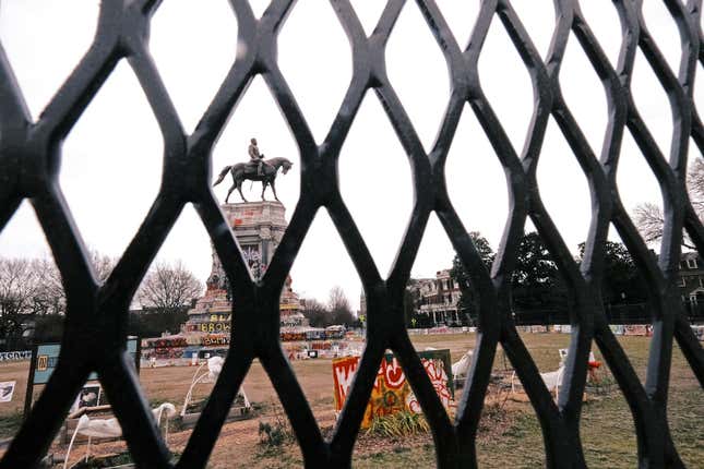 An 8-foot fence is erected around the Robert E. Lee monument on January 25, 2021 in Richmond, Virginia. The State Department of General Services in Richmond installed the fence to ensure the safety of visitors and workers as they prepare the site for the removal of the statue. 