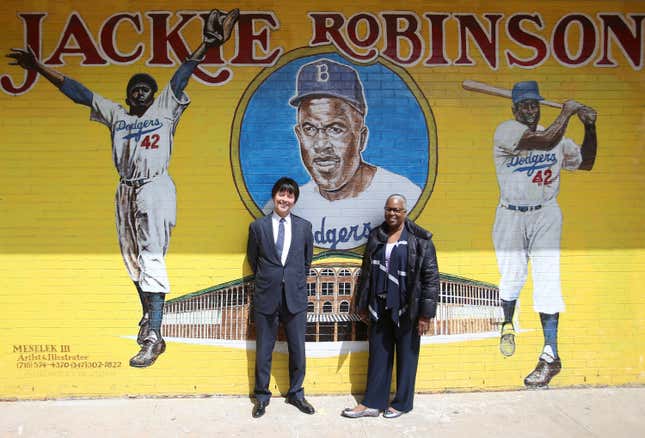 Filmmaker Ken Burns and Sharon Robinson, daugther of Jackie Robinson pose for a pciture outside P.S. 375, The Jackie Robinson School, on April 11, 2016 in the Brooklyn borough of New York City. 