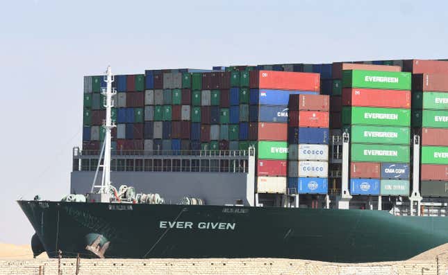 The Panama-flagged MV ‘Ever Given’ container ship is tugged in Egypt’s Suez Canal after it was fully dislodged from the banks, near Suez city, on March 29, 2021. 