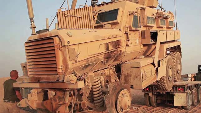 It Takes Three Extreme Machines To Flatbed An MRAP With A Blown Tire