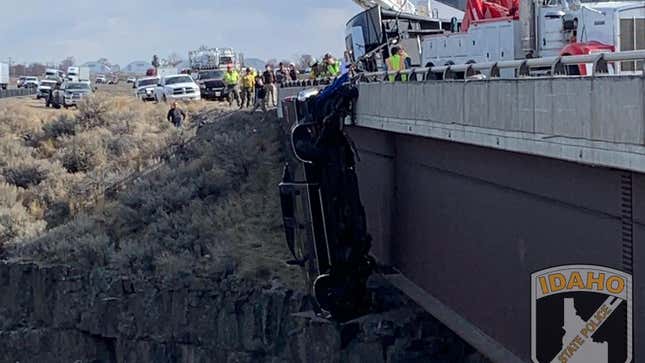 Image for article titled Couple Inside Ford Super Duty Saved From Plunge Off Bridge Thanks To Trailer Safety Chains