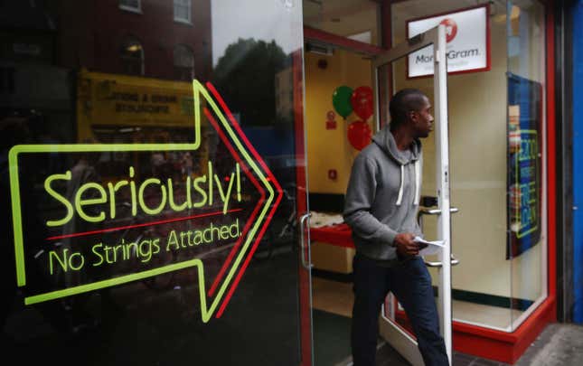 A man walks out of a payday loan store.