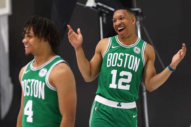 Grant Williams #12 of the Boston Celtics smiles behind Carsen Edwards #4 during Celtics Media Day at High Output Studios on September 30, 2019 in Canton, Massachusetts.