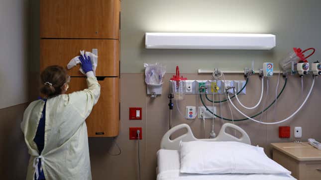 File photo of a worker cleaning a room at Regional Medical Center on May 21, 2020 in San Jose, California.