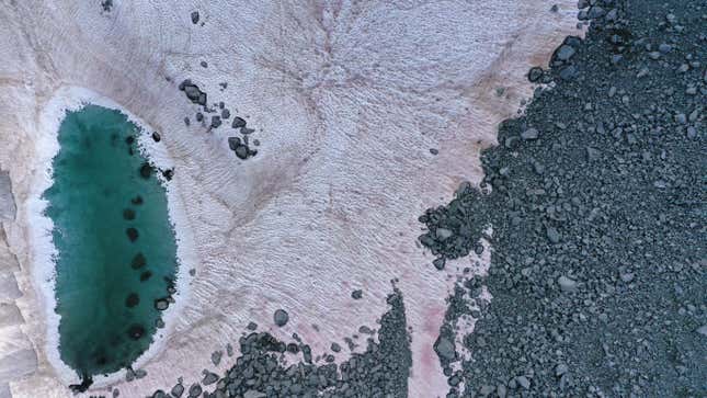An aerial picture taken on July 3, 2020, above the Presena glacier near Pellizzano, shows pink-colored snow.