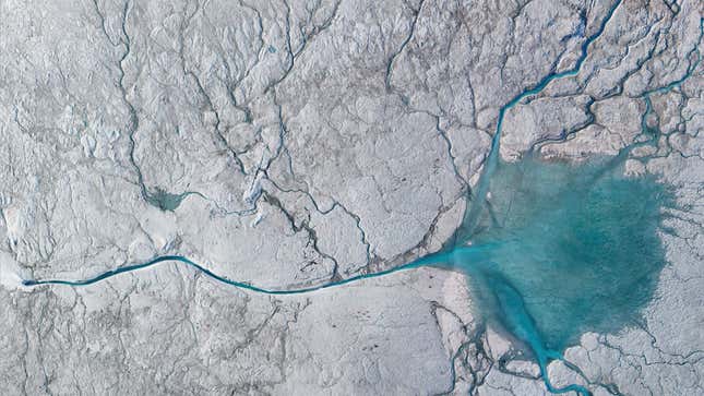 A stream of meltwater flowing into a moulin on the Greenland Ice sheet