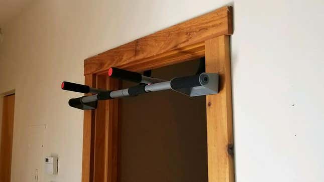 Image for article titled Area Man Installs Home Pull-Up Bar To Absentmindedly Tap While Passing Through Hallway