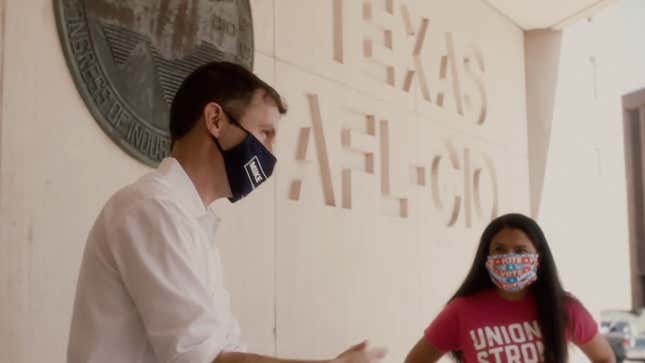 A scene from a new ad cut by the Sunrise Movement, featuring Congressional candidate Mike Siegel in front of the AFL-CIO building in Austin. The ad is narrated by union member Ryan Pollock.