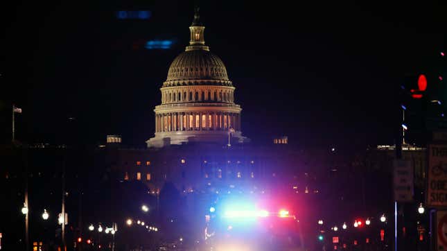 A police car drives away from the Capital after thousands of Donald Trump supporters stormed the United States Capitol building following a “Stop the Steal” rally on January 06, 2021 in Washington, D.C. 