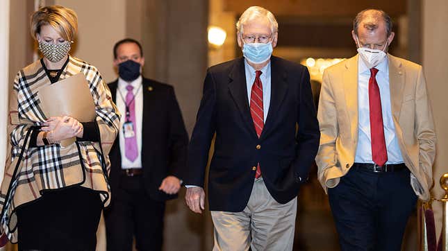 U.S. Senate Majority Leader Mitch McConnell (R-KY) walks to the Senate floor on Capitol Hill on December 20, 2020 in Washington, DC. Republicans and Democrats in the Senate finally came to an agreement on the coronavirus relief bill on Sunday. 