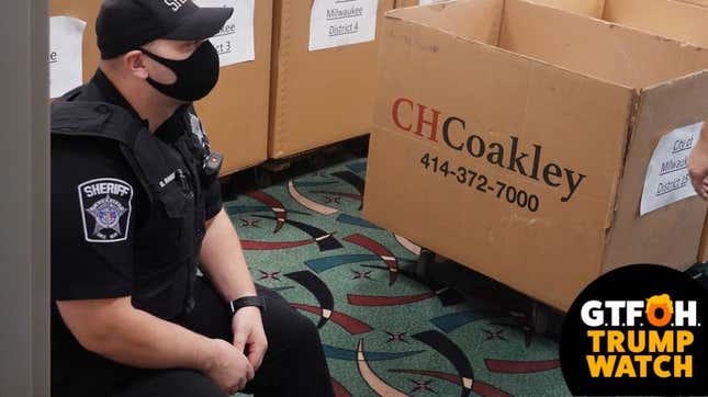 Police stand guard over ballots from the November 3 election being stored in the Wisconsin Center before the start of a recount scheduled to begin tomorrow on November 19, 2020 in Milwaukee, Wisconsin.