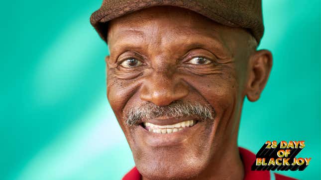 Portrait of happy senior African American man looking at camera