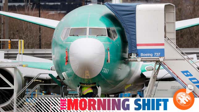 A worker looks up underneath a Boeing 737 MAX jet Monday, Dec. 16, 2019, in Renton, Wash. Shares of Boeing fell before the opening bell on a report that the company may cut production of its troubled 737 MAX or even end production all together.