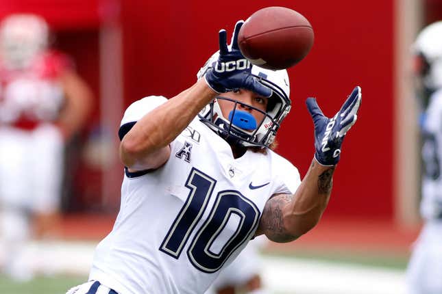 Zavier Scott #10 of the Connecticut Huskies warms up before the game against the Indiana Hoosiers at Memorial Stadium on September 21, 2019 in Bloomington, Indiana.