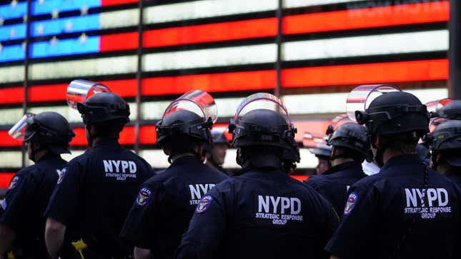 NYPD police officers watch demonstrators in Times Square on June 1, 2020, during a “Black Lives Matter” protest. 