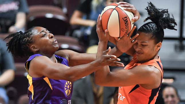 Los Angeles Sparks’ Nneka Ogwumike (left) and Connecticut Sun’s Alyssa Thomas, fight for a rebound during a contentious Game 2 of a WNBA playoff game, Sept. 19, 2019 in which the Sparks suffered a major loss. Now, the WNBA is  looking into Sparks general manager Penny Toler’s locker room behavior after that game.