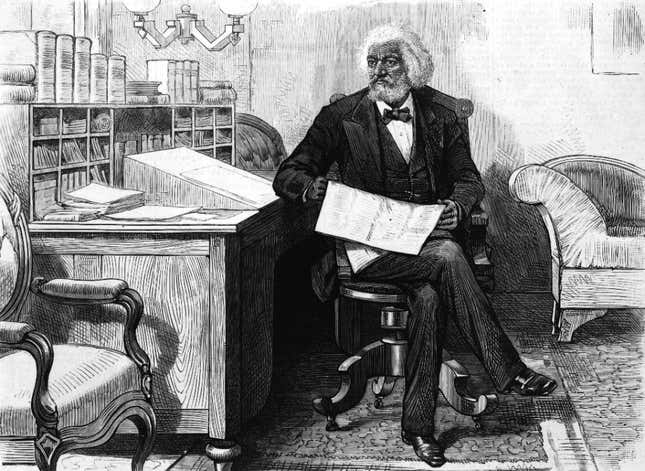 American orator, editor, author, abolitionist and former slave Frederick Douglass (1818 - 1895) edits a journal at his desk, late 1870s. 