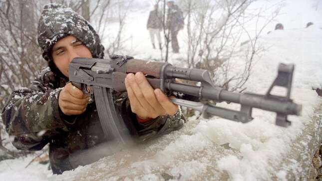 A soldier with the ethnic Albanian UCPMB, or Liberation Army of Presevo, Medvedja and Bujanovac, guards his positions on the front February 23, 2001 near the village of Shoshaj, Serbia, Yugoslavia.