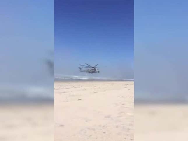 Watch Kenny Loggins Enter Danger Zone As Massive Chopper Lands On Beach