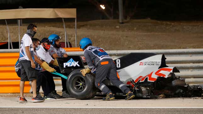 Image for article titled Haas Driver Romain Grosjean&#39;s F1 Car Goes Up In Flames, Spears Through Barrier, Splits In Half. Grosjean Walks Away