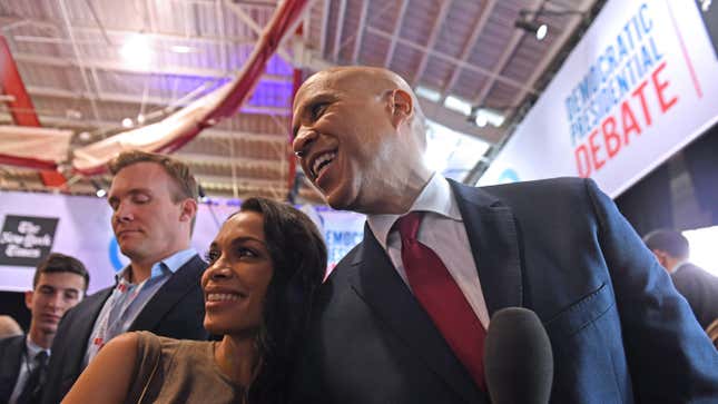 Rosario Dawson and Senator Cory Booker pose for pictures after the fourth Democratic primary debate of the 2020 presidential campaign on October 15, 2019. 