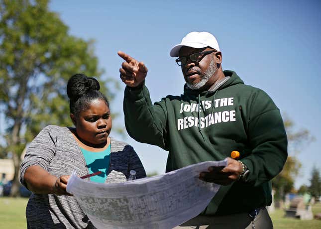 Kristi Williams, left, and Chief Egunwale Amusan view a cemetery map during a search for possible mass burial graves from Tulsa’s 1921 Race Massacre at Oaklawn Cemetery in Tulsa, Okla. 