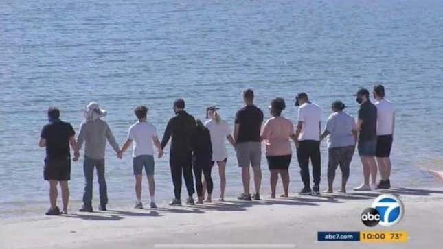 Image for article titled Glee Cast Hold Hands at Lake Where Naya Rivera's Body Was Found