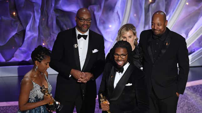 Karen Rupert Toliver and Matthew A. Cherry accept the Animated Short Film award for ‘Hair Love’ onstage during the 92nd Annual Academy Awards on February 09, 2020 in Hollywood, California.