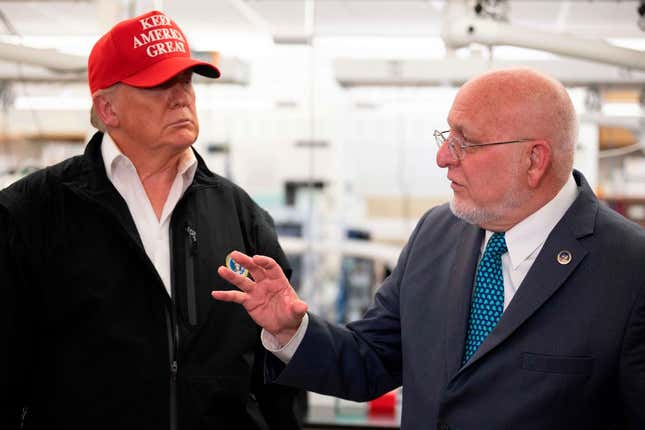 President Donald Trump (L) speaks with CDC Director Dr. Robert Redfield during a tour of the Centers for Disease Control and Prevention (CDC) in Atlanta, Georgia, on March 6, 2020.