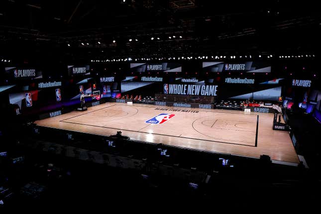 AUGUST 26: An empty court and bench is shown with the #WholeNewGame signage following the scheduled start time in Game Five of the Eastern Conference First Round between the Milwaukee Bucks and the Orlando Magic during the 2020 NBA Playoffs at AdventHealth Arena at ESPN Wide World Of Sports Complex on August 26, 2020 in Lake Buena Vista, Florida.