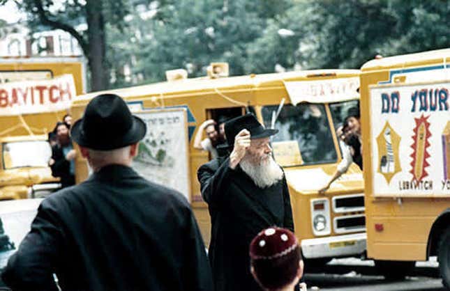 The Rebbe watching Mitzvah Tanks roll past in Crown Heights