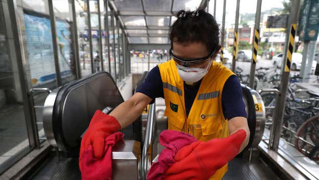 A disinfection worker sprays antiseptic solution at the subway station amid the coronavirus pandemic on August 26, 2020 in Seoul, South Korea.