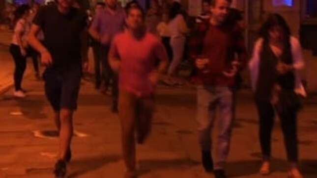 Cheers to This Fellow Fleeing the Scene at London Bridge, Pint in Hand