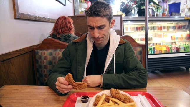 Image for article titled Man Searching For Part Of Chicken Tender Thin Enough To Fit Into Plastic Dipping Sauce Cup
