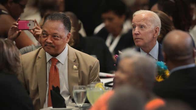 Former Vice President Joe Biden sits with the Rev. Jesse Jackson at Jackson’s Rainbow PUSH Coalition annual convention in Chicago, June 28, 2019, one day after Biden took a big hit on racial issues during the second night of the Democratic presidential primary debates.