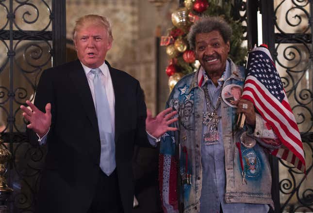 US President-elect Donald Trump, along with boxing promoter Don King, answers questions from the media after a day of meetings on December 28, 2016 at Mar-a-Lago in Palm Beach, Florida. / AFP / DON EMMERT