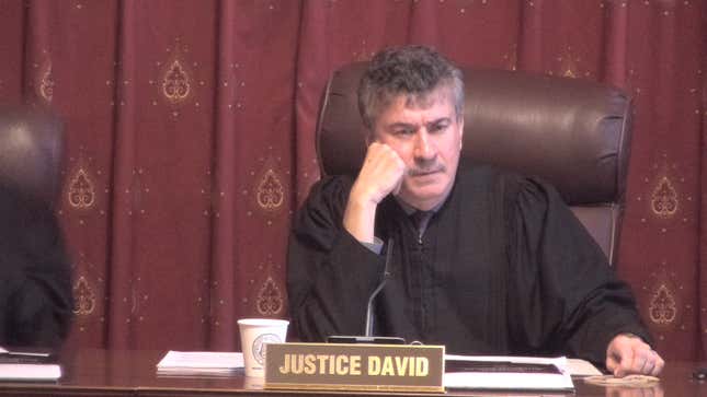 Indiana Supreme Court Justice Steven David weighing whether removing an unlabeled GPS tracker from one’s car is really theft or just a good idea.