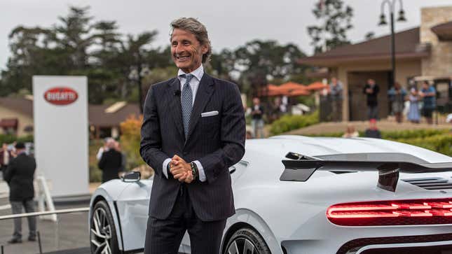 Stephan Winkelmann, ever dapper, at Pebble Beach showing off the EB110 tribute Chiron