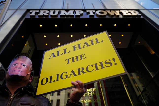 Protestors wearing Donald Trump masks rally outside of Trump Tower during an April Fools’ Day protest against U.S. President Donald Trump, April 1, 2019 in New York City.