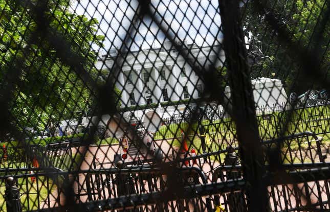 The White House is seen through several layers of recently erected security fencing and barricades from the north side of Lafayette Square in Washington, DC, on June 5 2020, amid ongoing demonstrations over the death of George Floyd in police custody.