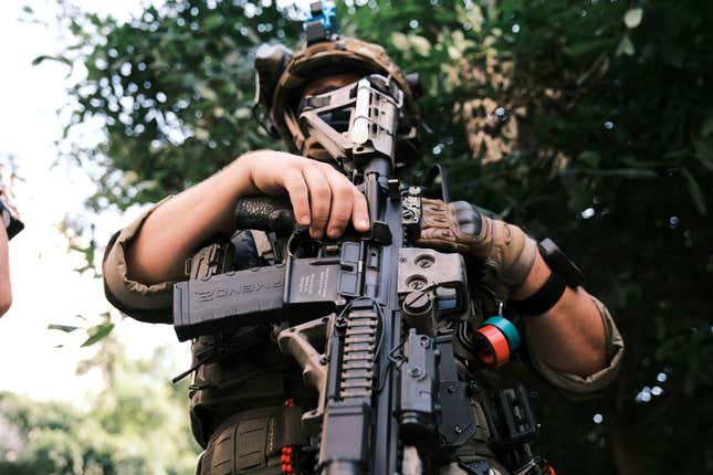 A man in full military gear pose for photo holding a gun during an open carry protest on July 4, 2020 in Richmond, Virginia. People attended an event in Virginia tagged “Stand with Virginia, Support the 2nd Amendment.”