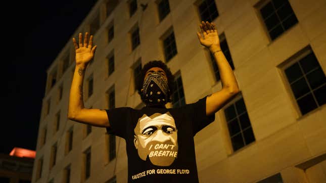 A demonstrator holds his hands up in protest near Lafayette Park and the White House on June 3, 2020 in Washington, DC. Protests in cities throughout the country continue in the wake of the death of George Floyd, a black man who was killed in police custody in Minneapolis on May 25.